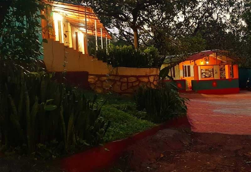 Dandeli Jungle Camp buildings at dusk, Pradhani