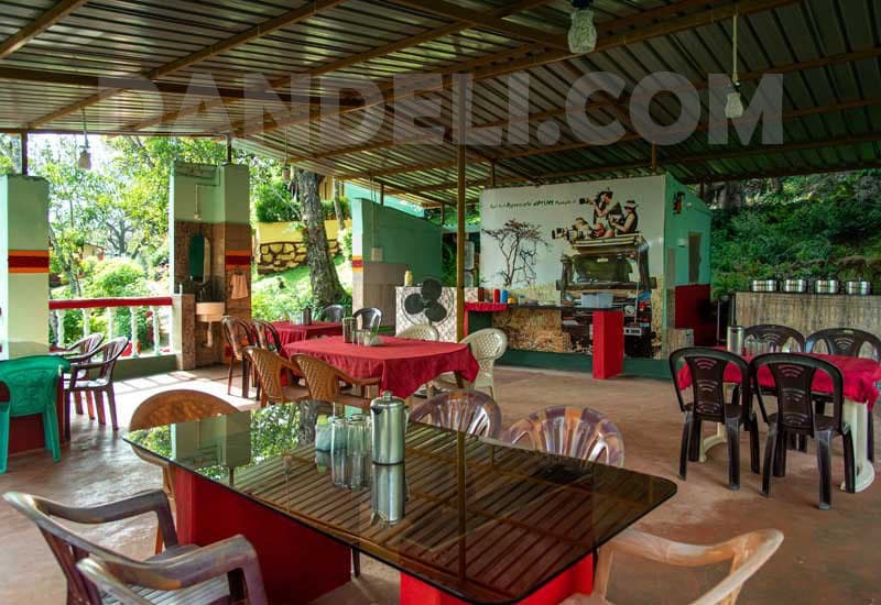 Open-air dining and common area at Dandeli Jungle Camp